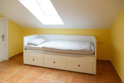 Ein Bett oder Betten in einem Zimmer der Unterkunft Kapitänshaus Mühlenpark Haus 6 Wo 25