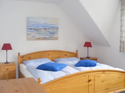 Ein Bett oder Betten in einem Zimmer der Unterkunft Mühlenpark 2 Mühlenpark Haus A Wo 5