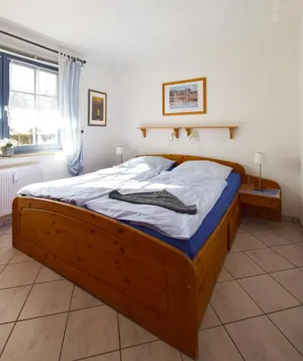 Ein Bett oder Betten in einem Zimmer der Unterkunft Eichenpark Haus 4 Wohnung 2