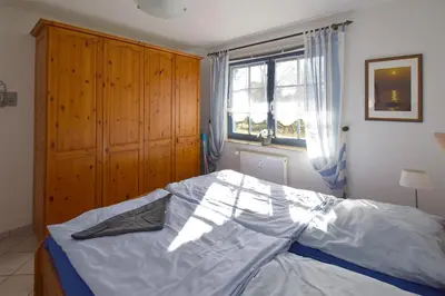 Ein Bett oder Betten in einem Zimmer der Unterkunft Eichenpark Haus 4 Wohnung 2
