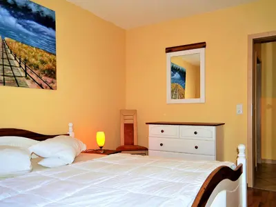 Ein Bett oder Betten in einem Zimmer der Unterkunft Moewennest
