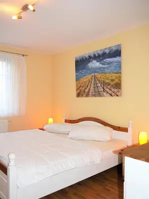 Ein Bett oder Betten in einem Zimmer der Unterkunft Moewennest