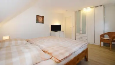 Ein Bett oder Betten in einem Zimmer der Unterkunft Am Darßwald Haus 2 1