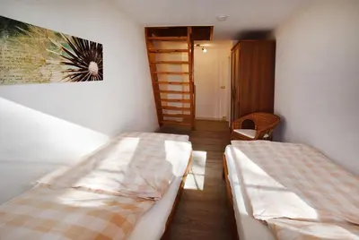 Ein Bett oder Betten in einem Zimmer der Unterkunft Am Darßwald Haus 2 1