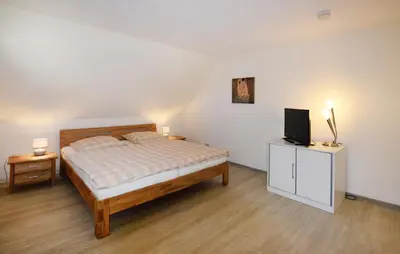 Ein Bett oder Betten in einem Zimmer der Unterkunft Am Darßwald Haus 2 1