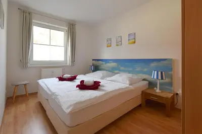 Ein Bett oder Betten in einem Zimmer der Unterkunft Buchenpark Wo 6