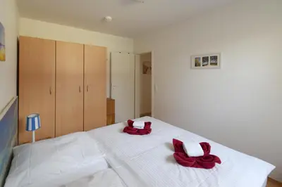 Ein Bett oder Betten in einem Zimmer der Unterkunft Buchenpark Wo 6