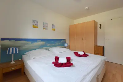 Ein Bett oder Betten in einem Zimmer der Unterkunft Buchenpark Wo 6