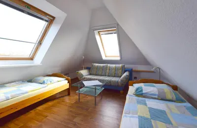 Ein Bett oder Betten in einem Zimmer der Unterkunft Haus am Brunnen Haus 