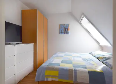 Ein Bett oder Betten in einem Zimmer der Unterkunft Haus am Brunnen Haus 