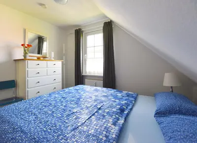 Ein Bett oder Betten in einem Zimmer der Unterkunft Buchengrund Wo 4