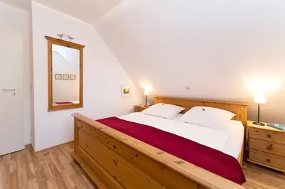 Ein Bett oder Betten in einem Zimmer der Unterkunft Buchengrund Wo 3