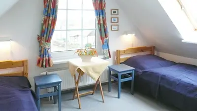 Ein Bett oder Betten in einem Zimmer der Unterkunft Buchengrund Wo 3