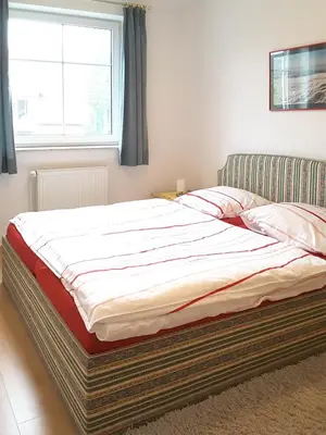 Ein Bett oder Betten in einem Zimmer der Unterkunft Frieseneck Wohnung 19