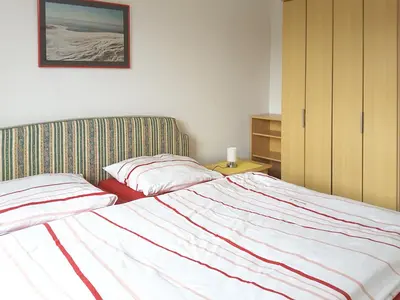 Ein Bett oder Betten in einem Zimmer der Unterkunft Frieseneck Wohnung 19