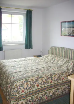 Ein Bett oder Betten in einem Zimmer der Unterkunft Frieseneck Wohnung 19
