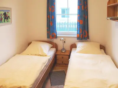 Ein Bett oder Betten in einem Zimmer der Unterkunft Haus Albatros Albatros Wo 2