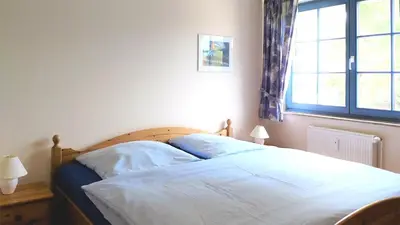 Ein Bett oder Betten in einem Zimmer der Unterkunft Eichenpark Haus 4 Wohnung 7