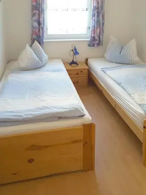 Ein Bett oder Betten in einem Zimmer der Unterkunft Haus Albatros Albatros Wo 1