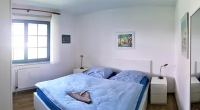 Ein Bett oder Betten in einem Zimmer der Unterkunft Eichenpark Haus 4 Wohnung 1