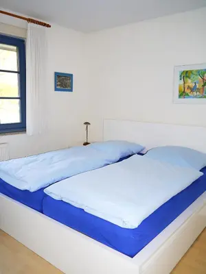 Ein Bett oder Betten in einem Zimmer der Unterkunft Eichenpark Haus 4 Wohnung 1