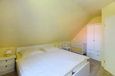Ein Bett oder Betten in einem Zimmer der Unterkunft Ankerplatz RH 5