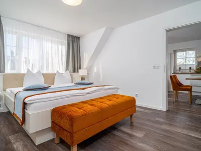 Ein Bett oder Betten in einem Zimmer der Unterkunft Tom's Hof Ferienwohnung Dascha