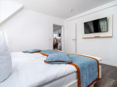Ein Bett oder Betten in einem Zimmer der Unterkunft Tom's Hof Ferienwohnung Dascha