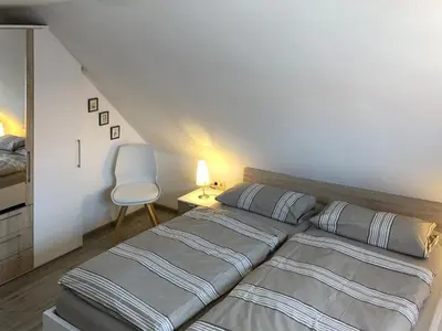 Ein Bett oder Betten in einem Zimmer der Unterkunft Am Wiesengrund Haushälfte 13