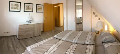 Ein Bett oder Betten in einem Zimmer der Unterkunft Am Wiesengrund Haushälfte 13