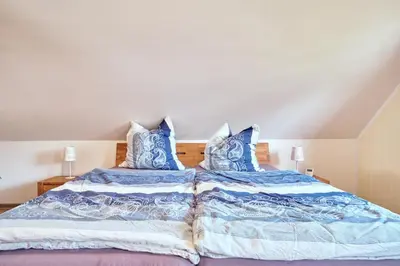 Ein Bett oder Betten in einem Zimmer der Unterkunft Findus