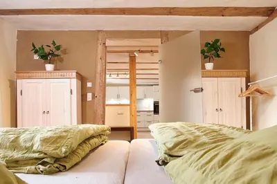 Ein Bett oder Betten in einem Zimmer der Unterkunft Aufschwung I Haushälfte