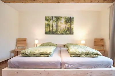 Ein Bett oder Betten in einem Zimmer der Unterkunft Aufschwung I Haushälfte