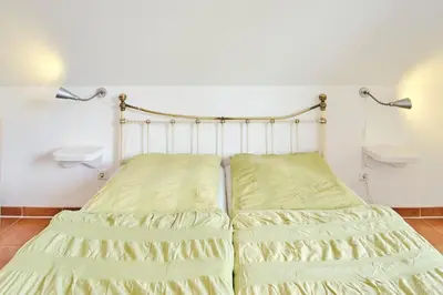 Ein Bett oder Betten in einem Zimmer der Unterkunft Aufwind II Haushälfte