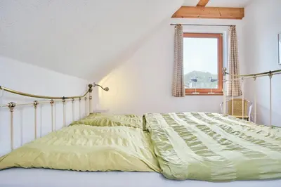 Ein Bett oder Betten in einem Zimmer der Unterkunft Aufwind II Haushälfte