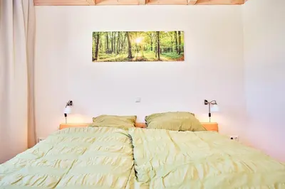 Ein Bett oder Betten in einem Zimmer der Unterkunft Waldlicht