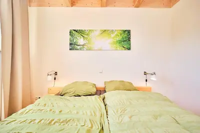 Ein Bett oder Betten in einem Zimmer der Unterkunft Waldlicht
