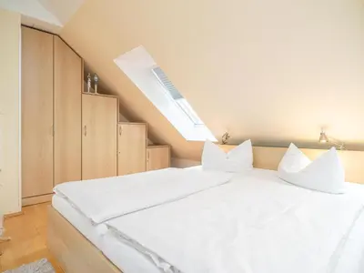 Ein Bett oder Betten in einem Zimmer der Unterkunft Residenz am Strand Wohnung 4-63