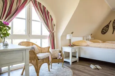 Ein Bett oder Betten in einem Zimmer der Unterkunft Ferienhaus Schilfrohrsänger, Fuhlendorf