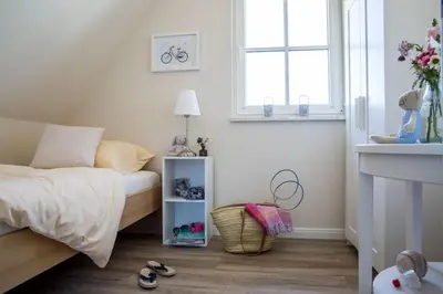 Ein Bett oder Betten in einem Zimmer der Unterkunft Ferienhaus Schilfrohrsänger, Fuhlendorf