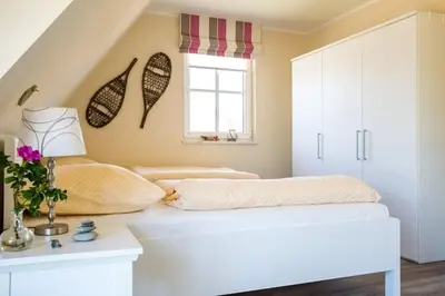 Ein Bett oder Betten in einem Zimmer der Unterkunft Ferienhaus Schilfrohrsänger, Fuhlendorf