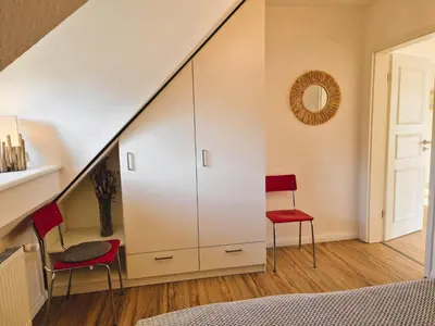 Ein Bett oder Betten in einem Zimmer der Unterkunft Swart Johann - 4 Personen, Haustier, Nähe Bodden, WLAN