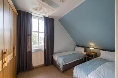 Ein Bett oder Betten in einem Zimmer der Unterkunft Haus am Schilf - Wohnung 3