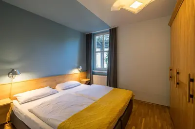 Ein Bett oder Betten in einem Zimmer der Unterkunft Haus am Schilf - Wohnung 1