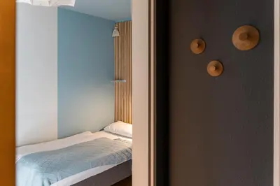 Ein Bett oder Betten in einem Zimmer der Unterkunft Haus am Schilf - Wohnung 2