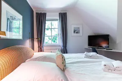 Ein Bett oder Betten in einem Zimmer der Unterkunft Steuerbord