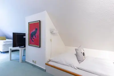 Ein Bett oder Betten in einem Zimmer der Unterkunft Steuerbord