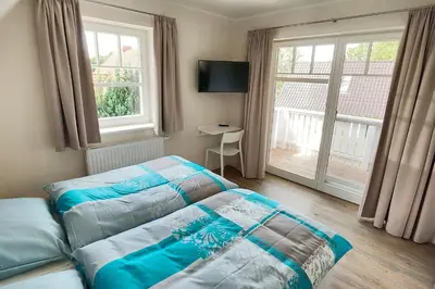 Ein Bett oder Betten in einem Zimmer der Unterkunft Ostseekristall - a63391
