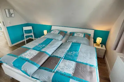 Ein Bett oder Betten in einem Zimmer der Unterkunft Ostseekristall - a63391