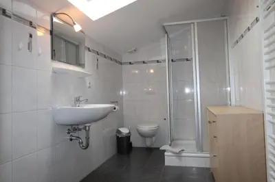 Ein Badezimmer in der Unterkunft Kapitänshaus FW 4 OG re